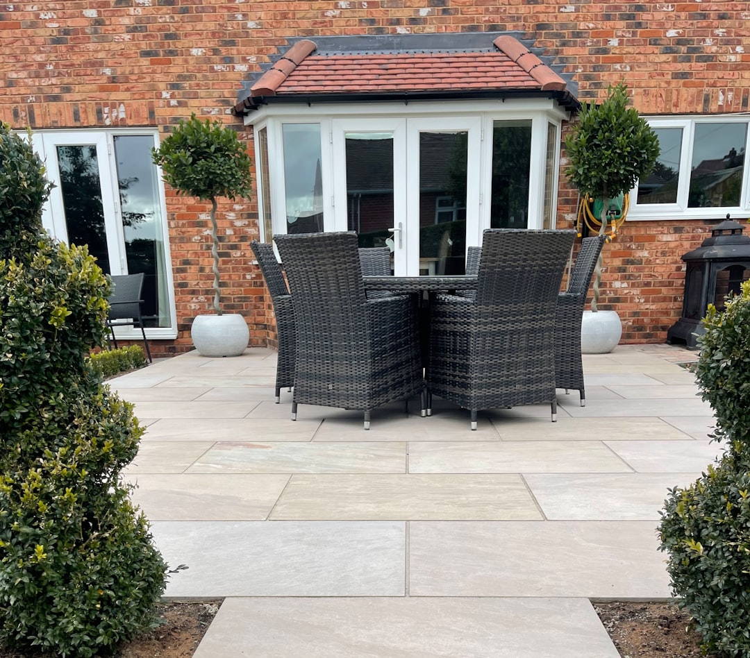 Patio doors opening onto a landscaped garden with outdoor furniture