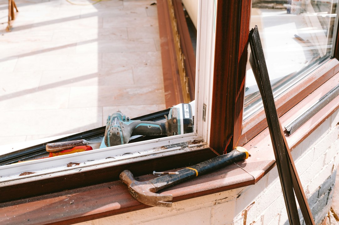 Hammer and drill on a window sill during a window replacement