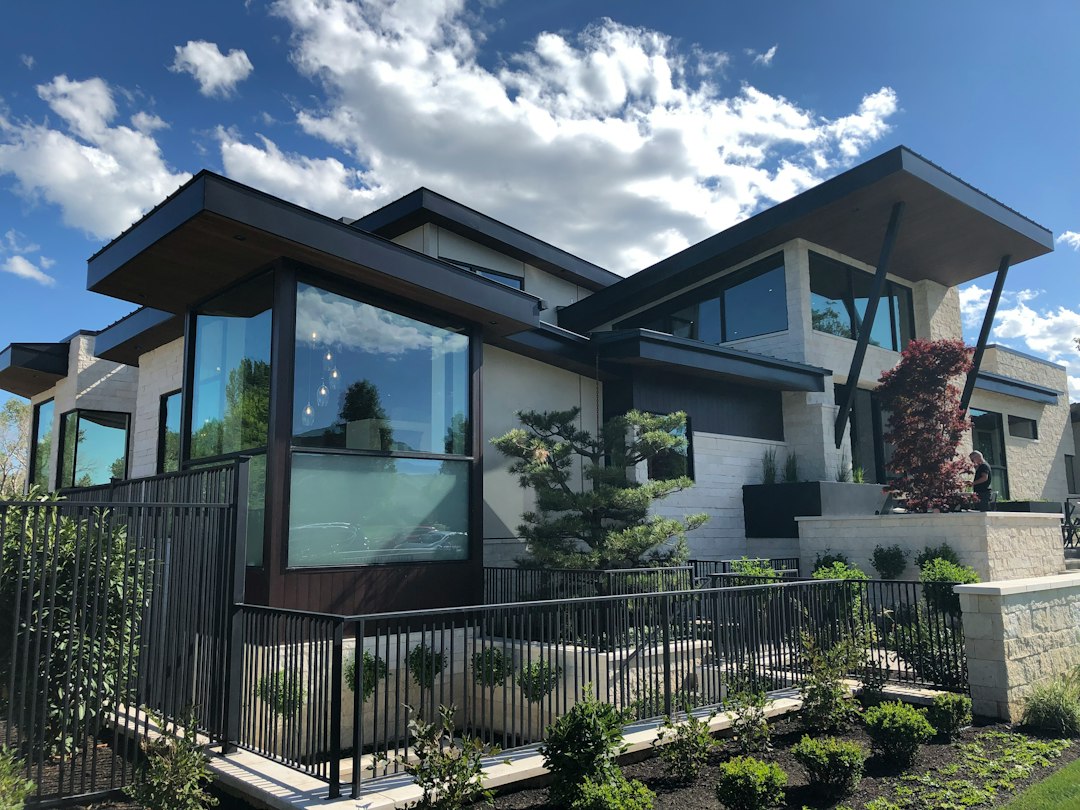 White-framed replacement windows on a house facade